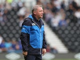 Ally McCoist, the Rangers manager, looks on during the pre season friendly match between Derby County and Rangers at iPro Stadium on August 2, 2014