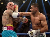 Amir Khan connects with a right at Luis Collazo during their welterweight bout at the MGM Grand Garden Arena on May 3, 2014