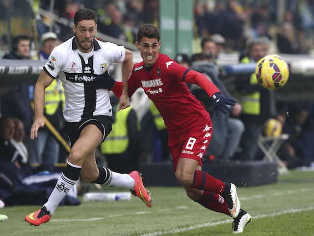 Andrea Rispoli of Parma FC competes for the ball with Danilo Fernando Avelar of Cagliari Calcio during the Serie A match on December 14, 2014