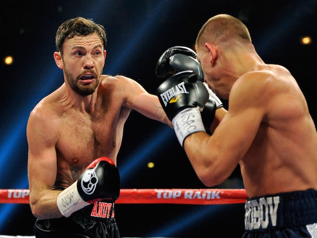 Andy Lee (L) and Matt Korobov battle during their fight for a vacant WBO middleweight title at The Chelsea at The Cosmopolitan of Las Vegas on December 13, 2014
