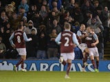 Burnley players celebrate with Burnley's English striker Ashley Barnes after he scores the opening goal of the English Premier League football match between Burnley and Southampton at Turf Moor in Burnley, north west England, on December 13, 2014