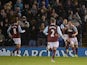 Burnley players celebrate with Burnley's English striker Ashley Barnes after he scores the opening goal of the English Premier League football match between Burnley and Southampton at Turf Moor in Burnley, north west England, on December 13, 2014