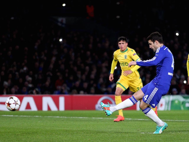Cesc Fabregas of Chelsea scores the openiung goal from the penalty spot during the UEFA Champions League group G match between Chelsea and Sporting Lisbon on December 10, 2014