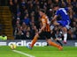 Diego Costa of Chelsea shoots past Alex Bruce of Hull City to score their second goal during the Barclays Premier League match between Chelsea and Hull City at Stamford Bridge on December 13, 2014 