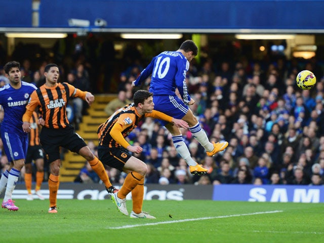 Eden Hazard of Chelsea (10) scores their first goal with a header during the Barclays Premier League match between Chelsea and Hull City at Stamford Bridge on December 13, 2014