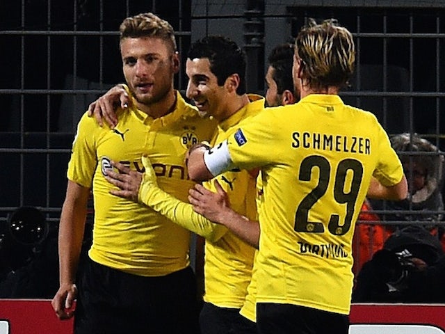 Dortmund's Italian striker Ciro Immobile (L) celebrates scoring with his team-mates during the second leg UEFA Champions League Group D football match against Anderlecht on December 9, 2014