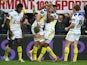 Damien Chouly of Clermont Auvergne is congratulated by teams mates after scoring his second try during the European Rugby Champions Cup pool one match between ASM Clermont Auvergne and Munster at Stade Marcel Michelin on December 14, 2014