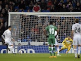 Real Madrid's Portuguese forward Cristiano Ronaldo (L) scores on a penalty kick during the UEFA Champions League Group B football match against PFC Ludogorets on December 9, 2014