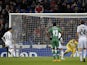 Real Madrid's Portuguese forward Cristiano Ronaldo (L) scores on a penalty kick during the UEFA Champions League Group B football match against PFC Ludogorets on December 9, 2014
