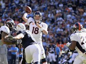 Manning breaks NFL passing yard record
