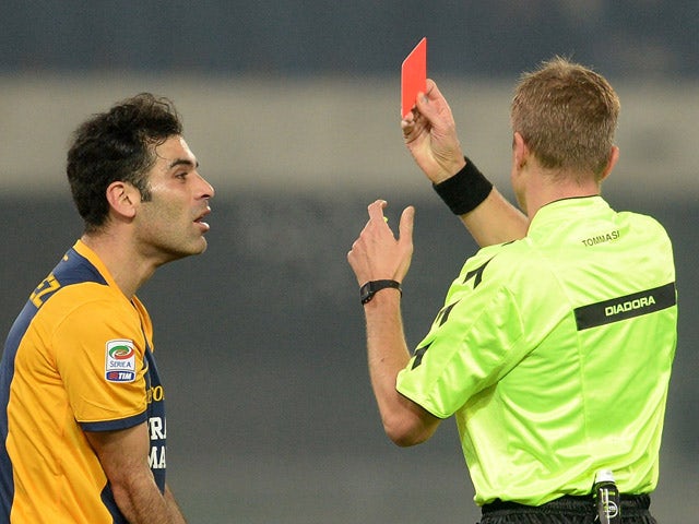 Referee Dino Tommasi shows red card to Rafael Marquez during the Serie A match between Hellas Verona FC and UC Sampdoria at Stadio Marc'Antonio Bentegodi on December 8, 2014 