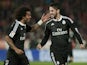 Real Madrid's forward Isco (R) celebrates with Brazilian defender Marcelo after scoring during the Spanish league football match UD Almeria vs Real Madrid CF on December 12, 2014