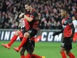 Guingamp's French forward Jeremy Pied (M) celebrates with teammates after scoring during the French L1 football match between EA Guingamp and Paris Saint-Germain (PSG), on December 14, 2014