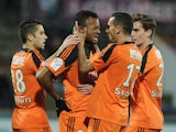 Lorient's Ghanaian forward Jordan Ayew celebrates with his teammates after scoring a goal during the French L1 football match between Lorient (FCL) and Metz (FCM) on December 13, 2014