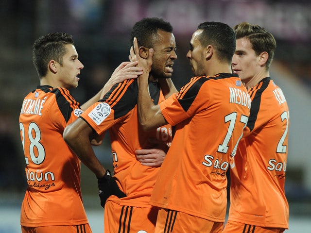 Lorient's Ghanaian forward Jordan Ayew celebrates with his teammates after scoring a goal during the French L1 football match between Lorient (FCL) and Metz (FCM) on December 13, 2014