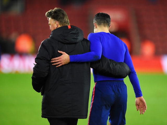 Louis van Gaal, manager of Manchester United hugs Robin van Persie of Manchester United after the Barclays Premier League match between Southampton and Manchester United at St Mary's Stadium on December 8, 2014