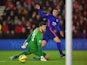  Robin van Persie of Manchester United scores past Fraser Forster of Southampton for the opening goal during the Barclays Premier League match between Southampton and Manchester United at St Mary's Stadium on December 8, 2014