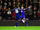 Robin van Persie of Manchester United celebrates scoring the opening goal during the Barclays Premier League match between Southampton and Manchester United at St Mary's Stadium on December 8, 2014