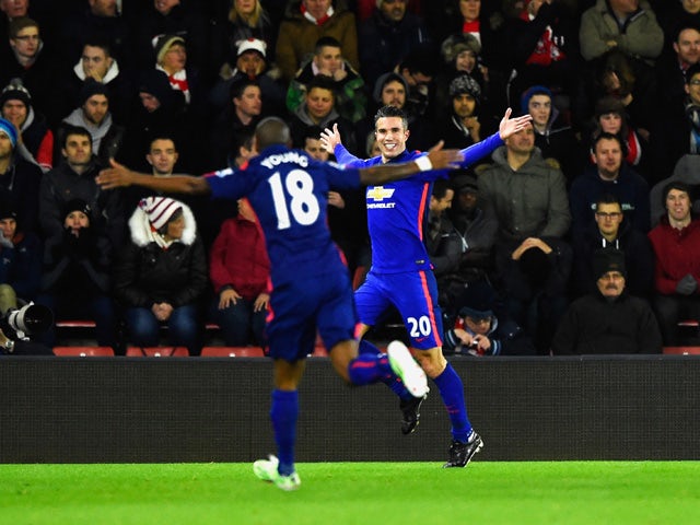 Robin van Persie of Manchester United celebrates scoring the opening goal during the Barclays Premier League match between Southampton and Manchester United at St Mary's Stadium on December 8, 2014