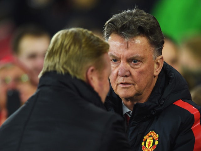Louis van Gaal, manager of Manchester United shakes hands with Ronald Koeman, manager of Southampton during the Barclays Premier League match between Southampton and Manchester United at St Mary's Stadium on December 8, 2014