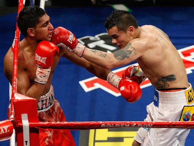 Marcos Maidana of Argentina connects with a left at Amir Khan of England during the WBA super lightweight title fight at Mandalay Bay Events Center on December 11, 2010