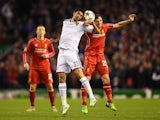 Mohamed Elneny of FC Basel and Joe Allen of Liverpool compete for a header during the UEFA Champions League group B match on December 9, 2014