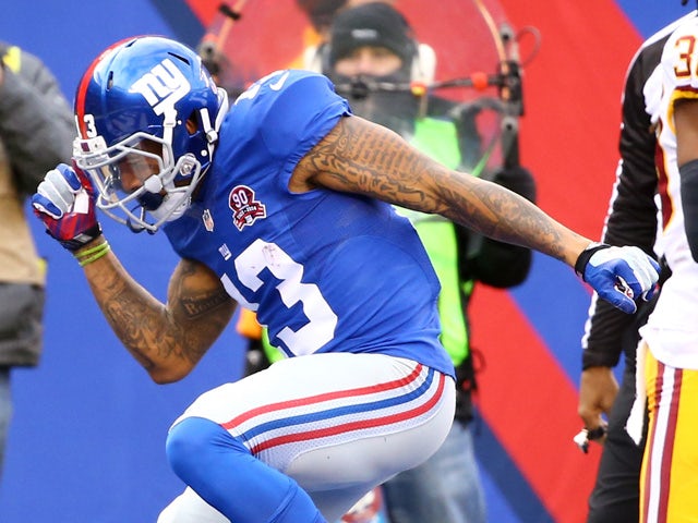 Odell Beckham Jr. #13 of the New York Giants celebrates after scoring 10 yard touchdown thrown by Eli Manning #10 in the first quarter against the Washington Redskins during their game at MetLife Stadium on December 14, 2014