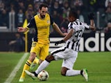 Juventus' defender from France Patrice Evra (R) fights for the ball with Atletico Madrid's defender Juanfran during the UEFA Champions League football match on December 9, 2014