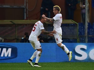Roma edge past 10-man Genoa