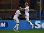 Roma's midfielder from Belgium Radja Nianggolan (L) celebrates with Roma's defender from Greece Jose Holebas after scoring during the Italian Serie A football match against Genoa on December 14, 2014