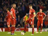 Dejected Liverpool players Rickie Lambert and Steven Gerrard look on after conceding the opening goal during the UEFA Champions League group B match against Basel on December 9, 2014