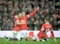 Manchester United's Dutch striker Robin van Persie (2nd L) celebrates scoring their third goal with Juan Mata and Wayne Rooney during the game with Liverpool on December 14, 2014