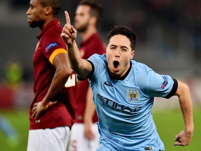 Manchester City's French midfielder Samir Nasri celebrates after scoring during the UEFA Champions League football match AS Roma vs Manchester City on December 10, 2014