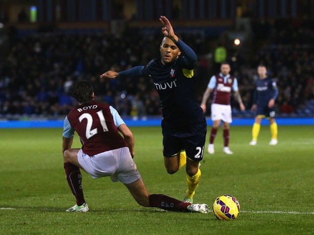 Ryan Bertrand of Southampton is brought down in the penalty area by George Boyd of Burnley leading to a penalty during the Barclays Premier League match between Burnley and Southampton at Turf Moor on December 13, 2014