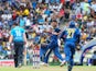 Sri Lankan cricketer Suranga Lakmal celebrates with teammates the dismissal of England cricketer Eoin Morgan during the sixth One Day International (ODI) match between Sri Lanka and England at the Pallekele International Cricket Stadium in Pallekele on De