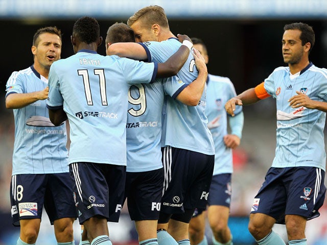 Marc Janko of Sydney celebrates with team-mates afer scoring a goal during the round 11 A-League match between Melbourne Victory and Sydney FC at Etihad Stadium on December 13, 2014