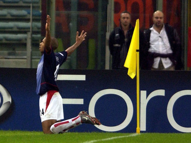 Thierry Henry of Arsenal celebrates scoring during the UEFA Champions League Second Phase match against AS Roma on November 27, 2002