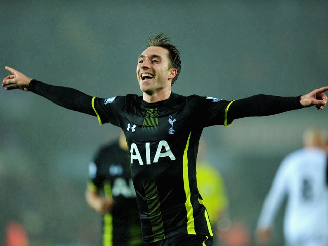  Spurs player Christian Eriksen celebrates after scoring the second Spurs goal during the Barclays Premier League match between Swansea City and Tottenham Hotspur at Liberty Stadium on December 14, 2014