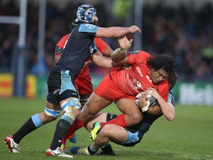 Toulouse's New Zealand-born Samoan prop Census Johnston is tackled during the European Rugby Champions Cup rugby union match between Glasgow and Toulouse at Scotstoun Stadium in Glasgow, Scotland on December 13, 2014