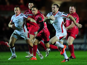Darren Cave of Ulster breaks through to go over for his side's first try during the European Rugby Champions Cup match between Scarlets and Ulster Rugby at Parc y Scarlets on December 14, 2014 