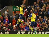 Mathieu Debuchy of Arsenal celebrates scoring his goal during the Barclays Premier League match between Liverpool and Arsenal at Anfield on December 21, 2014