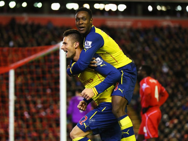 Olivier Giroud of Arsenal celebrates scoring his goal with Danny Welbeck of Arsenal during the Barclays Premier League match between Liverpool and Arsenal at Anfield on December 21, 2014