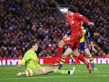 Lazar Markovic of Liverpool has his shot saved by Wojciech Szczesny of Arsenal during the Barclays Premier League match between Liverpool and Arsenal at Anfield on December 21, 2014
