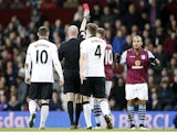 Referee shows the red card to Aston Villa's English striker Gabriel Agbonlahor (R) during the English Premier League football match between Aston Villa and Manchester United at Villa Park in Birmingham, central England, on December 20, 2014