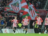 Athletic Bilbao's midfielder Mikel Rico celebrates with teammates Athletic Bilbao's forward Iker Muniain and Athletic Bilbao's defender Mikel Balenziaga during the Spanish league football match Athletic Club Bilbao vs Club Atletico de Madrid at the San Ma