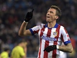 Atletico Madrid's Croatian forward Mario Mandzukic celebrates after scoring during the Spanish Copa del Rey (King's Cup) round of 32 second leg football match Club Atletico de Madrid vs CE L'Hospitalet at the Vicente Calderon stadium in Madrid on December
