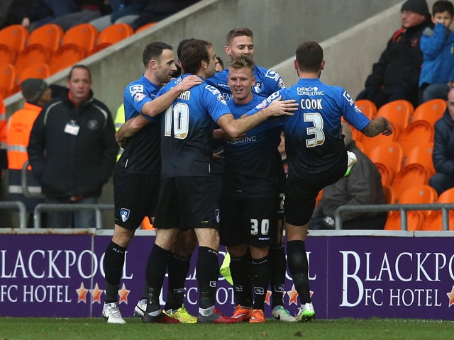 Matt Ritchie of AFC Bournemouth celebrates his goal with team mates during the Sky Bet Championship match between Blackpool and Bournemouth at Bloomfield Road on December 20, 2014
