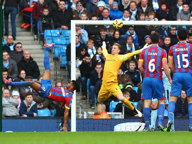 Fraizer Campbell of Crystal Palace performs an overhead kick at goal as Joe Hart of Manchester City comes out to save during the Barclays Premier League match between Manchester City and Crystal Palace at Etihad Stadium on December 20, 2014