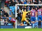 Fraizer Campbell of Crystal Palace performs an overhead kick at goal as Joe Hart of Manchester City comes out to save during the Barclays Premier League match between Manchester City and Crystal Palace at Etihad Stadium on December 20, 2014