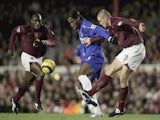 Didier Drogba of Chelsea holds back Philippe Senderos of Arsenal during the Barclays Premiership match between Arsenal and Chelsea at Highbury on December 18, 2005